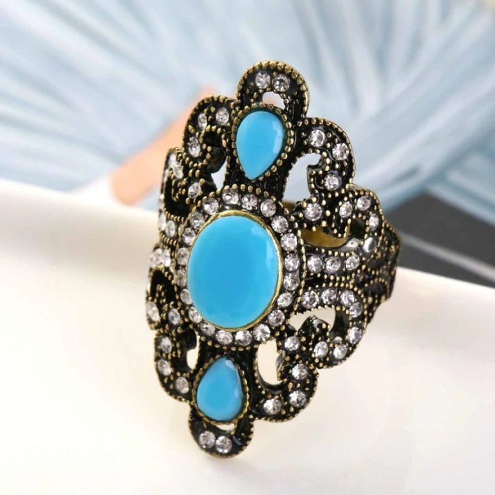 Vintage Bronze plated with blue resin crystal